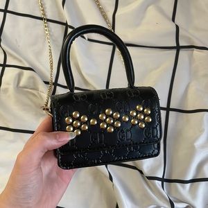 mini black and gold purse